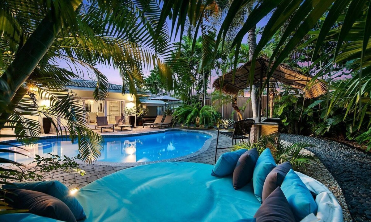 Poinsettia Heights House | Just 10min to downtown Ft. Lauderdale & beach, this modern home offers everything a group could want for an upscale relaxing getaway. Unwind in the very private and peaceful backyard oasis, featuring a heated pool ($), 6-person hot tub & fire pit.