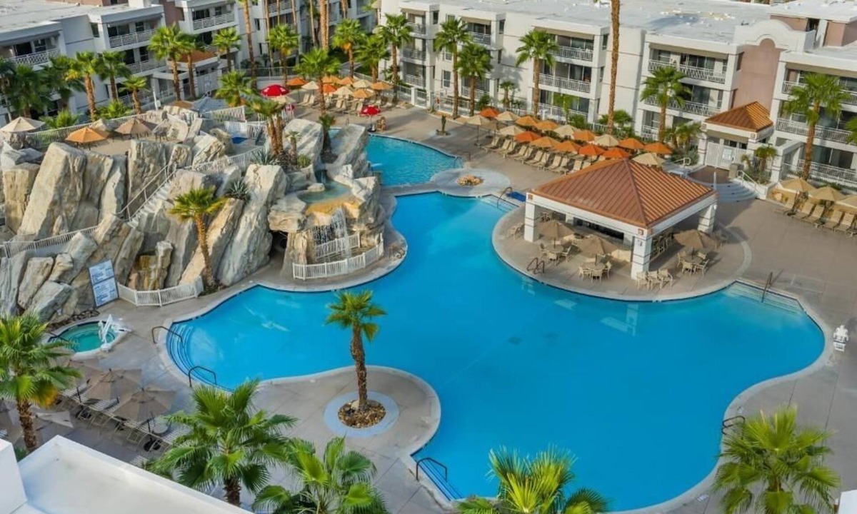 Canyon Corridor Hotel | Relax with Stunning Pool Views from Your Private Balcony in This Modern Suite