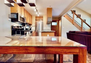 Located near the Village and can sleep a crowd! Year round hot tub near condo