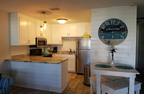 West Panama City Beach Condo | Beach access #73 across the street! Easy Parking!