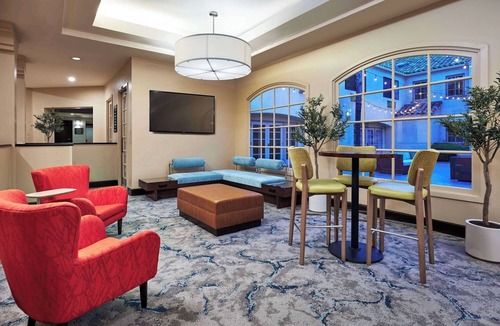 Valencia Hotel | Grand Balcony King Room | Overlooking Pool & Courtyard | On-Site Dining