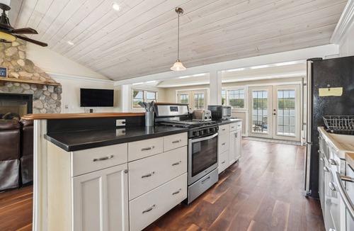 Gladwin House | Lakefront Gladwin Vacation Rental w/Deck & Dock!