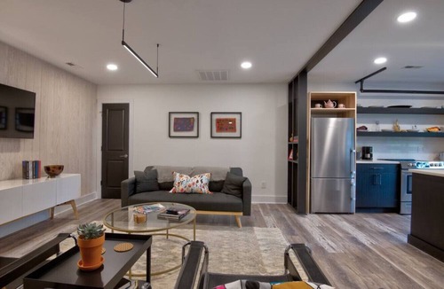 Charlotte House | Luxurious Guest House Retreat in Lower South End w/retractable glass garage door