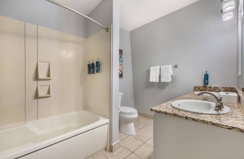 Canyon Corridor Hotel | Relax with Stunning Pool Views from Your Private Balcony in This Modern Suite
