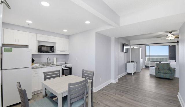 Beachfront Studio | Kitchen + Pool & Picnic Area in Ormond Beach