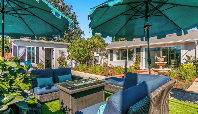 Gorgeous Midtown Gem with Sunroom and Guest Cottage. Half Mile to the Beach.