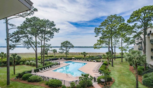 Updated & Gorgeous End Unit with Spectacular Views of Pool & Sound. South Beach Oasis Awaits you!